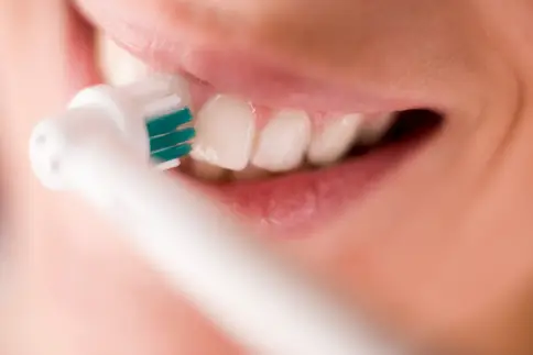 photo of brushing teeth